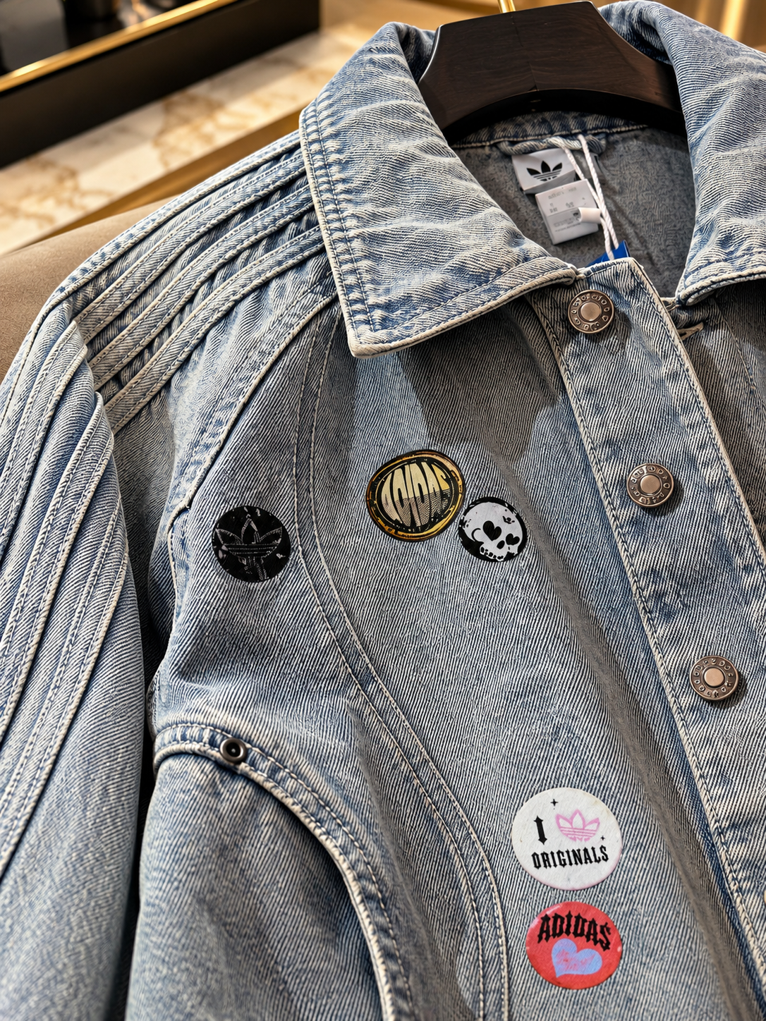 Vintage Washed Denim Trucker Jacket with Graphic Badge Accents